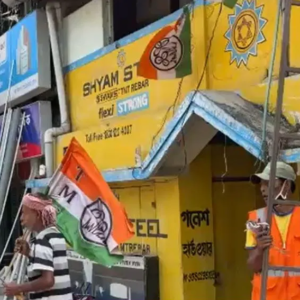 সরকারি জ্যাকেট গায়ে তৃণমূলের পতাকা! ধূপগুড়িতে নির্বাচনী বিধিকে বুড়ো আঙুল?